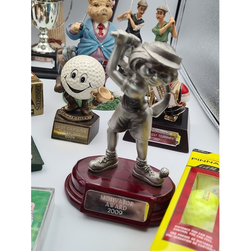 8 - A collection of Golf related memorabilia to include trophy's; ornaments, a golfing Owl, a St Andrews... 