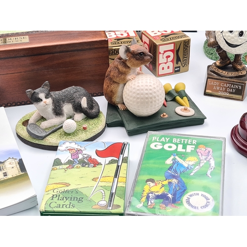 8 - A collection of Golf related memorabilia to include trophy's; ornaments, a golfing Owl, a St Andrews... 