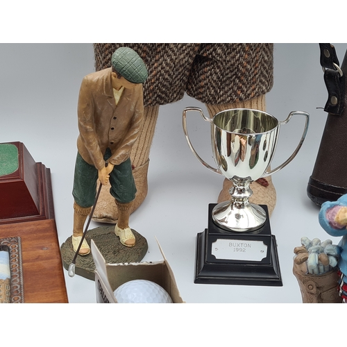 8 - A collection of Golf related memorabilia to include trophy's; ornaments, a golfing Owl, a St Andrews... 