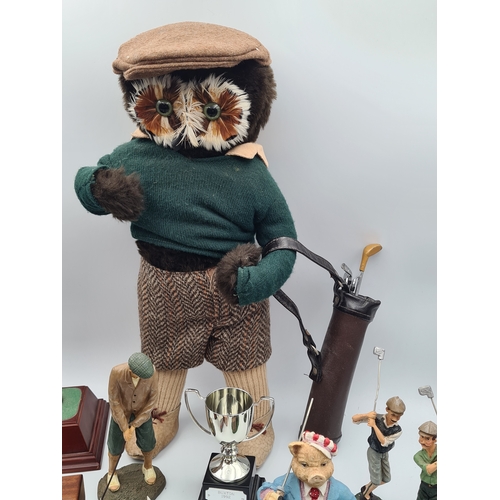 8 - A collection of Golf related memorabilia to include trophy's; ornaments, a golfing Owl, a St Andrews... 