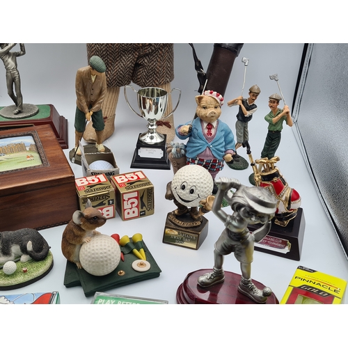 8 - A collection of Golf related memorabilia to include trophy's; ornaments, a golfing Owl, a St Andrews... 