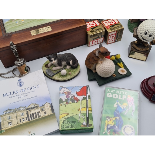 8 - A collection of Golf related memorabilia to include trophy's; ornaments, a golfing Owl, a St Andrews... 