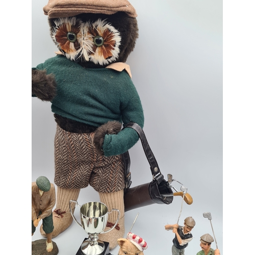 8 - A collection of Golf related memorabilia to include trophy's; ornaments, a golfing Owl, a St Andrews... 