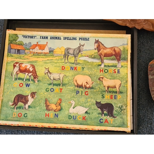 12 - A job lot of mainly wooden ethnic items to include: a carved statue; a carved mask; a carved tray; a... 