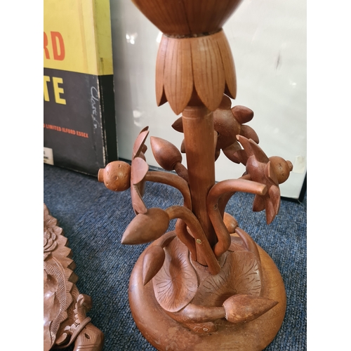 12 - A job lot of mainly wooden ethnic items to include: a carved statue; a carved mask; a carved tray; a... 