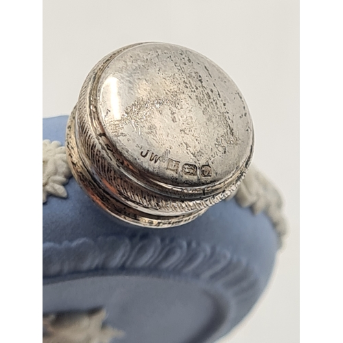 248 - A rare Wedgwood Blue Jasperware perfume scent bottle with Silver lid. Silver is marked.