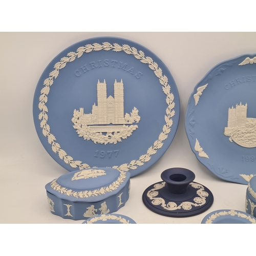 245 - A collection of 8 pieces of Wedgwood Jasperware in Blue. Includes a 1977 plate; a 1980 plate; 2 lidd... 