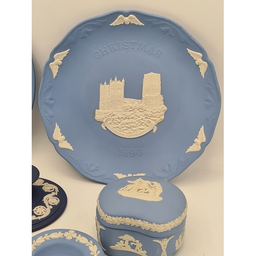 245 - A collection of 8 pieces of Wedgwood Jasperware in Blue. Includes a 1977 plate; a 1980 plate; 2 lidd... 