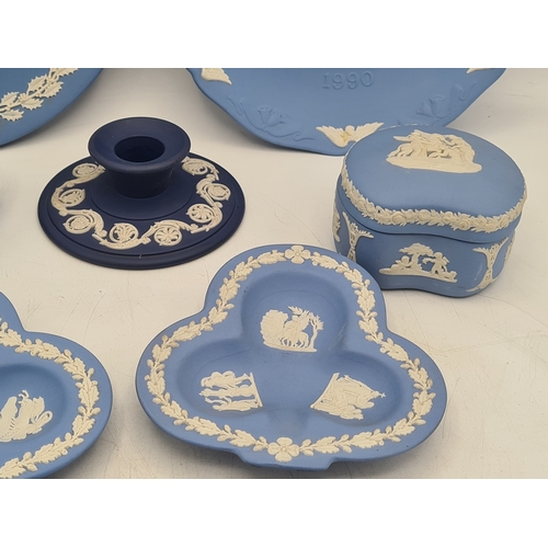 245 - A collection of 8 pieces of Wedgwood Jasperware in Blue. Includes a 1977 plate; a 1980 plate; 2 lidd... 