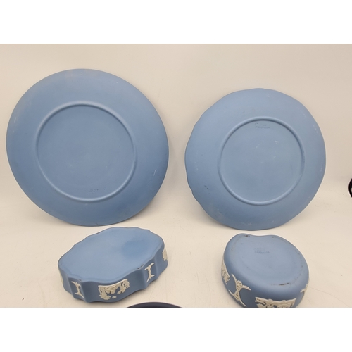 245 - A collection of 8 pieces of Wedgwood Jasperware in Blue. Includes a 1977 plate; a 1980 plate; 2 lidd... 