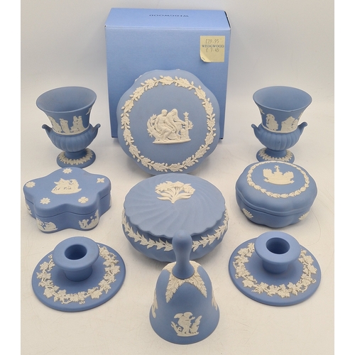 244 - A collection of 9 pieces of Wedgwood Jasperware in Blue. Includes 2 vases; 2 candlesticks; a bell an... 
