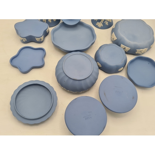 244 - A collection of 9 pieces of Wedgwood Jasperware in Blue. Includes 2 vases; 2 candlesticks; a bell an... 