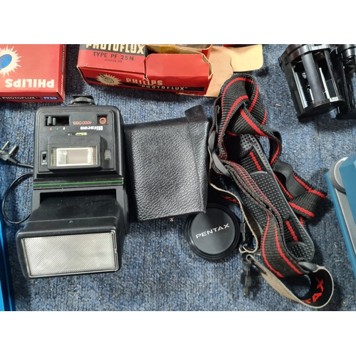 43 - A collection of photographic equipment to include: coloured filters; light bulbs, a tripod and level... 