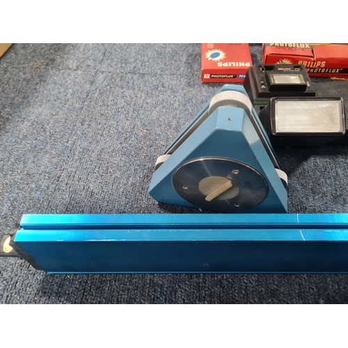 43 - A collection of photographic equipment to include: coloured filters; light bulbs, a tripod and level... 