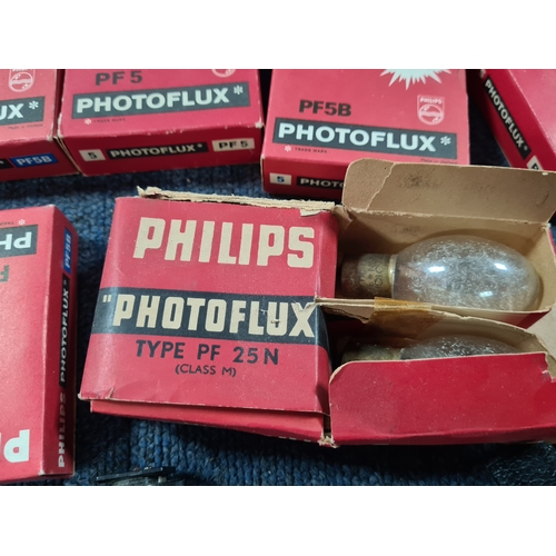 43 - A collection of photographic equipment to include: coloured filters; light bulbs, a tripod and level... 