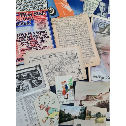 44 - A collection of Ephemara to include music score sheets, a Newspaper special on Princess Diana, postc... 