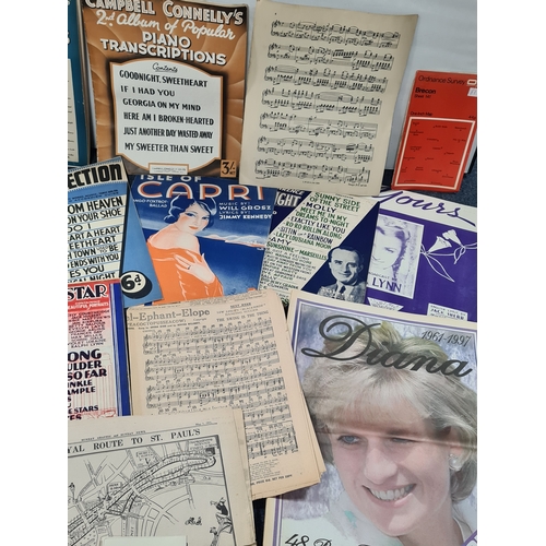 44 - A collection of Ephemara to include music score sheets, a Newspaper special on Princess Diana, postc... 
