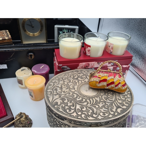 52 - A job lot of small items housed in a large black cash box (no key), items include clocks, various bo... 