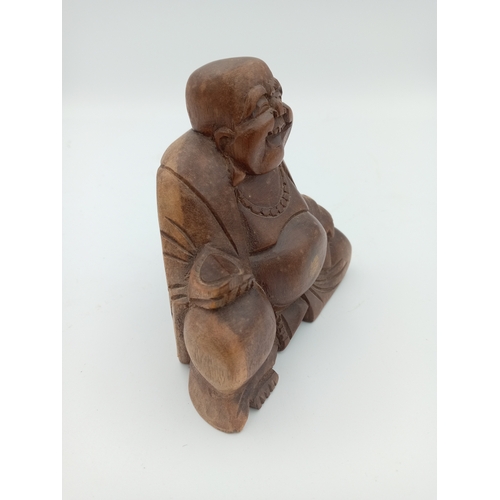 54 - A vintage carved wooden Buddah