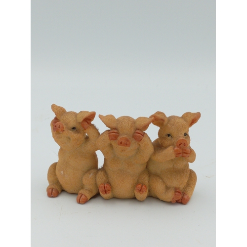 58 - A box full of pig figurines. Including a large collection of pig figures including a figure of 3 pig... 