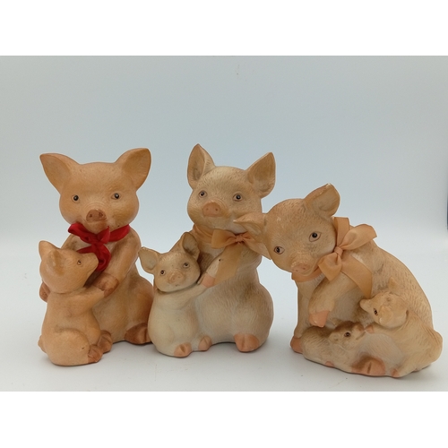 58 - A box full of pig figurines. Including a large collection of pig figures including a figure of 3 pig... 