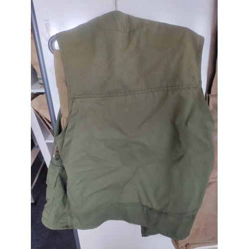 60 - A Collection of Fishing Equipment, to include; a sleeveless 'Garcia' Jacket, three pairs of beige tr... 