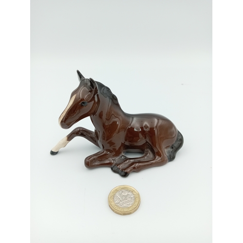 232 - A 'Royal Doulton' Ceramic Horse sitting down