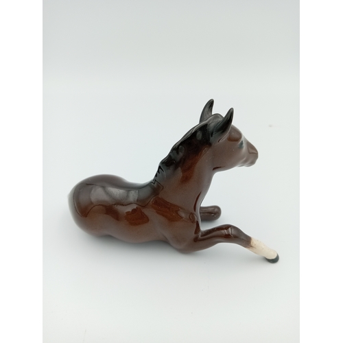 232 - A 'Royal Doulton' Ceramic Horse sitting down