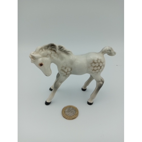 230 - A white 'Beswick' Ceramic Horse