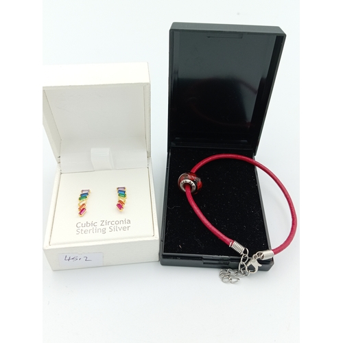 362 - A stamped 925 ALE silver Pandora charm on leather bracelet with sterling silver gold plated CZ earri... 