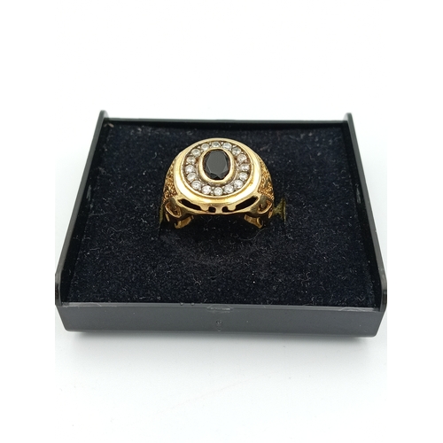 363 - A stamped 925 silver CZ Gold plated ring with black stone size N