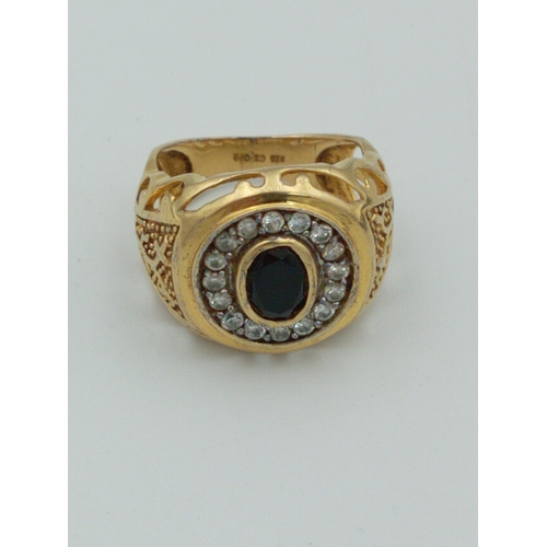 363 - A stamped 925 silver CZ Gold plated ring with black stone size N