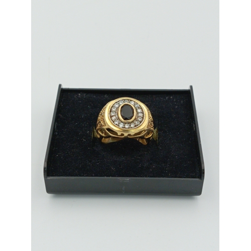 363 - A stamped 925 silver CZ Gold plated ring with black stone size N