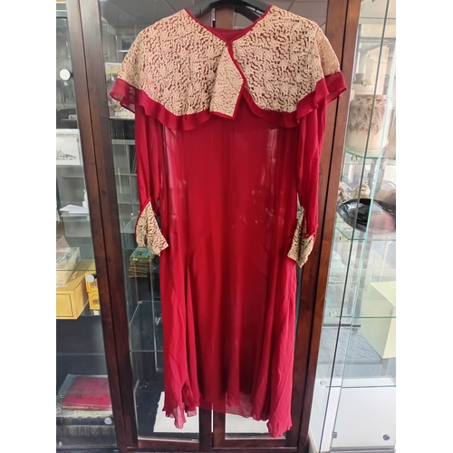 216 - A 1920's burgundy Chiffon dress with lace work A/F (rip to front lower half)