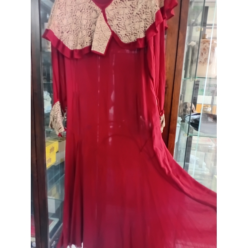 216 - A 1920's burgundy Chiffon dress with lace work A/F (rip to front lower half)