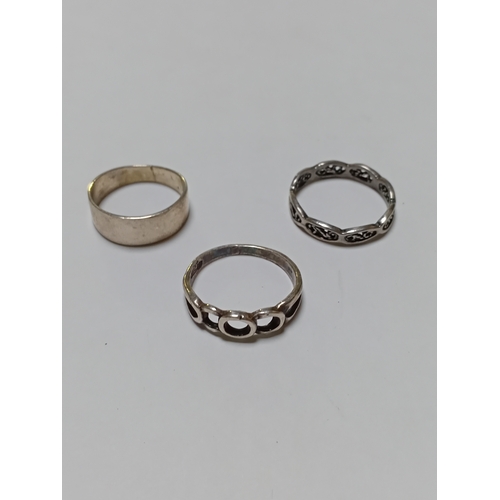364 - A trio of silver rings. Two are stamped 925.