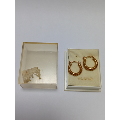 341 - A pair of hallmarked 375 9ct gold bamboo style hoop earrings.