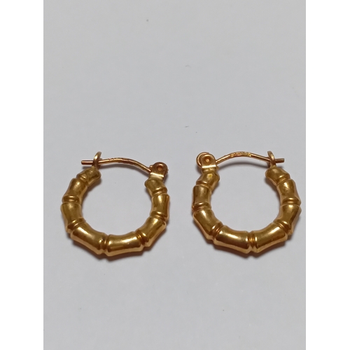 341 - A pair of hallmarked 375 9ct gold bamboo style hoop earrings.