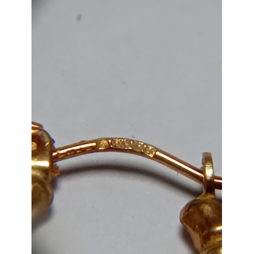 341 - A pair of hallmarked 375 9ct gold bamboo style hoop earrings.