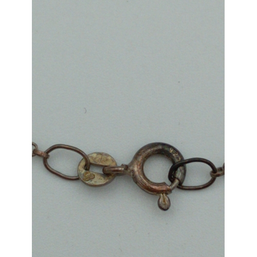 367 - A dolphin pendant made from a coin on a stamped 925 silver chain.