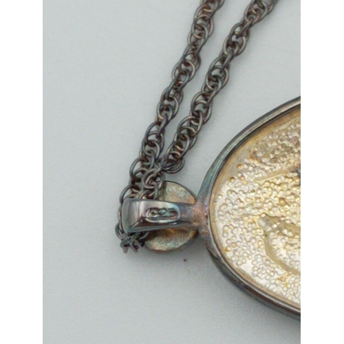 368 - A 'Brooks & Bentley'.925 stamped chain with a stamped .925 dolphin pendant.