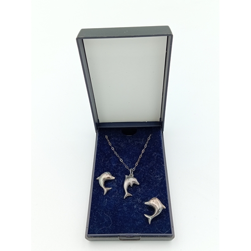 373 - A stamped 925 silver dolphin pendant on a chain and dolphin earrings set.
