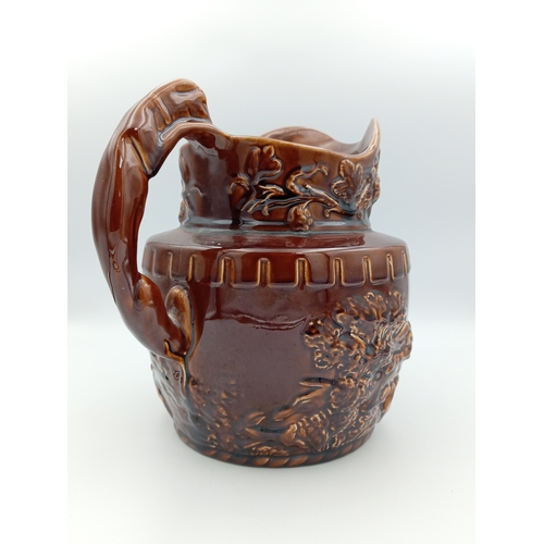 2 - A large ceramic brown jug. Made in England by 'Arthur Wood'