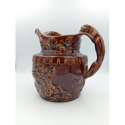 2 - A large ceramic brown jug. Made in England by 'Arthur Wood'
