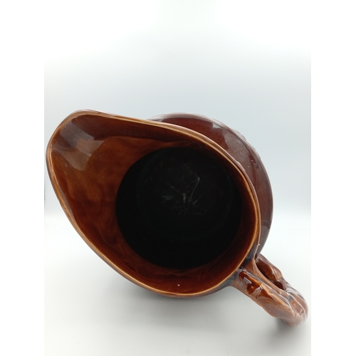 2 - A large ceramic brown jug. Made in England by 'Arthur Wood'