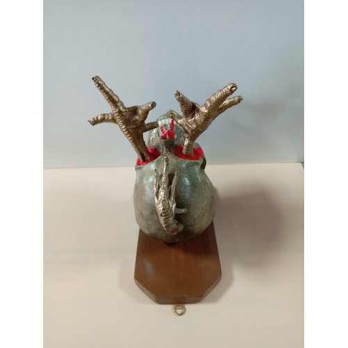 5 - A unique wall art by W.Hudson. Featuring a skull on a wooden frame with chicken legs sticking out of... 