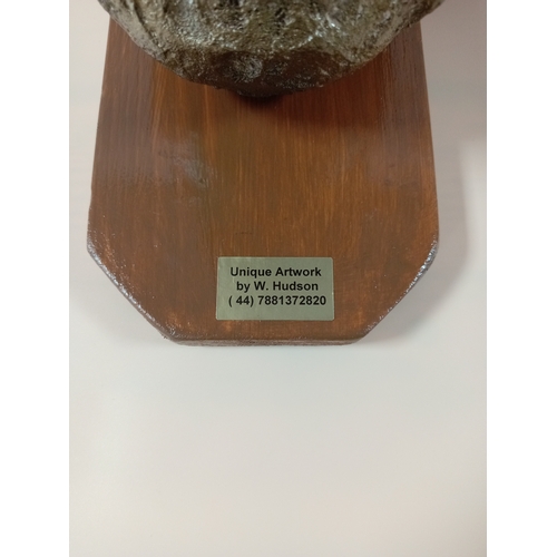 5 - A unique wall art by W.Hudson. Featuring a skull on a wooden frame with chicken legs sticking out of... 