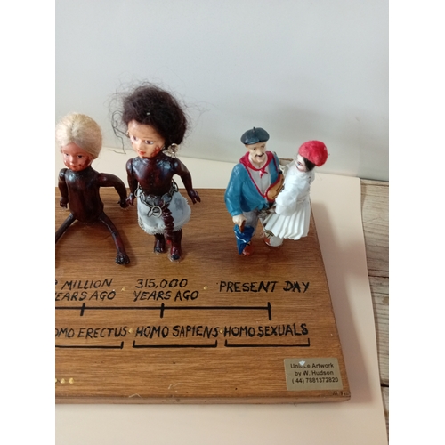 6 - The 'Evolution' of man with a twist by sculpture by W. Hudson.