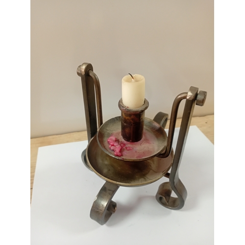 11 - A antique handheld candle stick designed to swivel when walking upstairs
