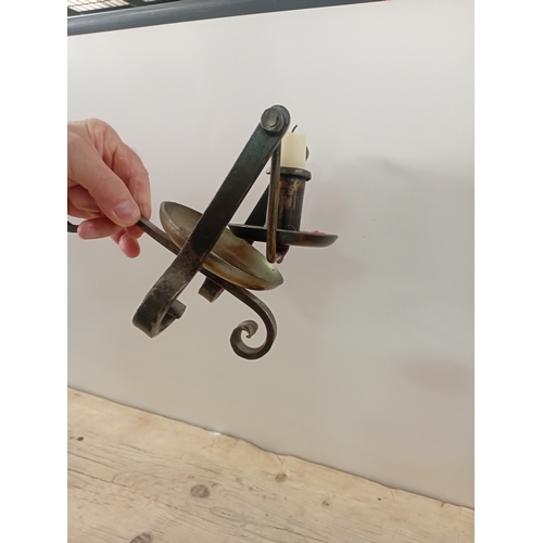 11 - A antique handheld candle stick designed to swivel when walking upstairs